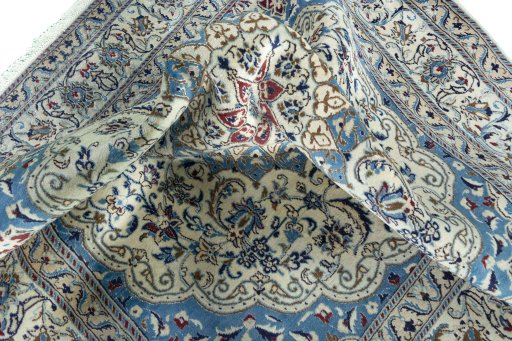Surface texture of 1970s Nain rug with natural Wool and intricate pattern