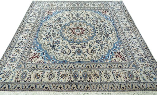 Surface texture of 1970s Nain rug with natural Wool and intricate pattern