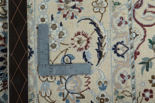 Backside of handmade New Nain rug showing knot structure and weave density
