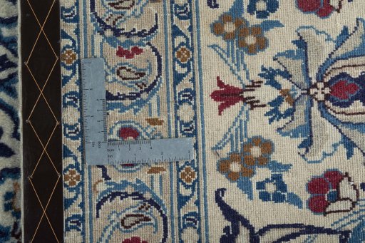 Backside of handmade New Nain rug showing knot structure and weave density