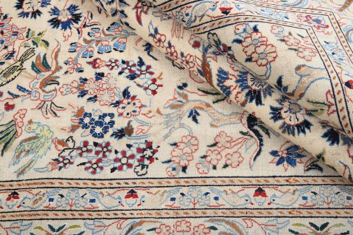 Backside of handmade 1980s Nain rug showing knot structure and weave density