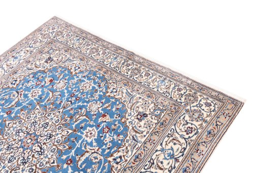 Surface texture of 1985s Nain rug with natural Wool and intricate pattern