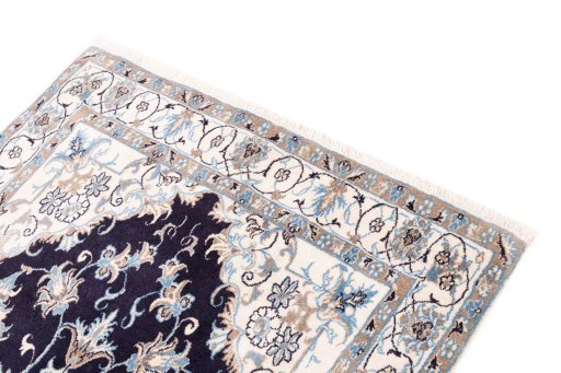 Surface texture of 2005s Nain rug with natural Wool and intricate pattern