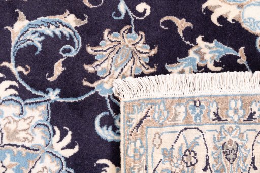 Close-up detail of 2005s Nain rug from Iran / Persia showing Wool weave