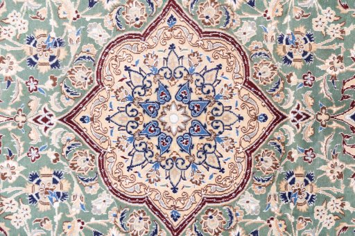 Corner detail of 1999s Nain rug showing border pattern and Wool pile