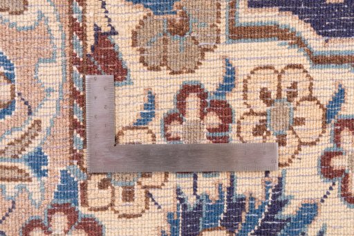 Corner detail of 1988s Nain rug showing border pattern and Wool pile