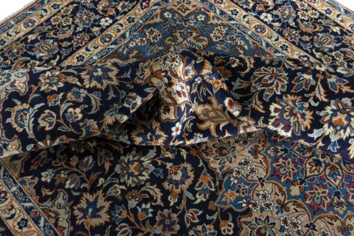 Surface texture of 2000s Najafabad rug with natural Wool and intricate pattern