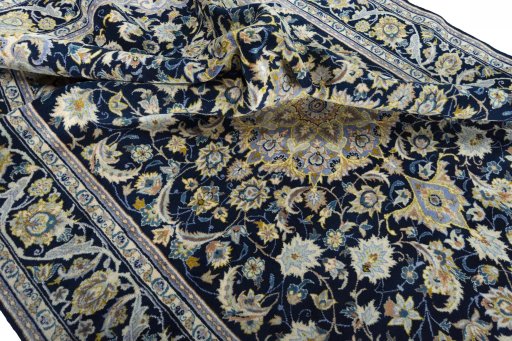Surface texture of 2000s Najafabad rug with natural Wool and intricate pattern
