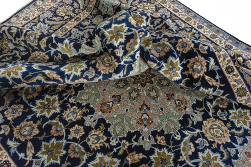 Surface texture of 2000s Najafabad rug with natural Wool and intricate pattern