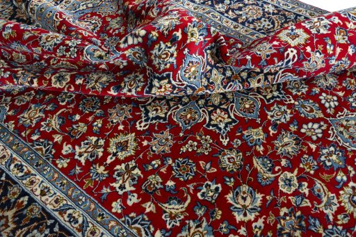 Surface texture of 2000s Najafabad rug with natural Wool and intricate pattern