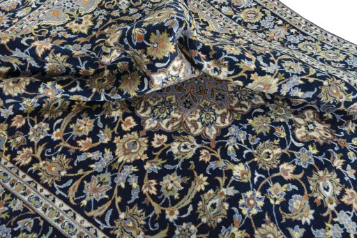 Surface texture of 2000s Najafabad rug with natural Wool and intricate pattern