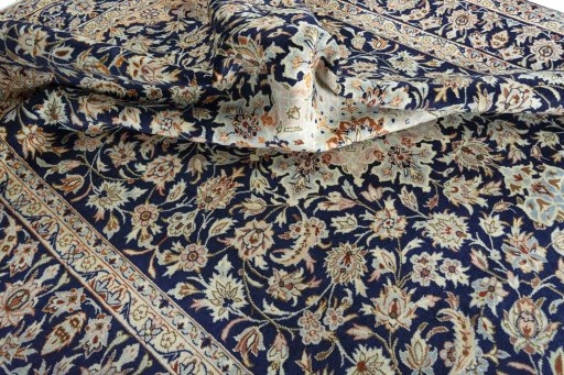 Surface texture of 2000s Najafabad rug with natural Wool and intricate pattern