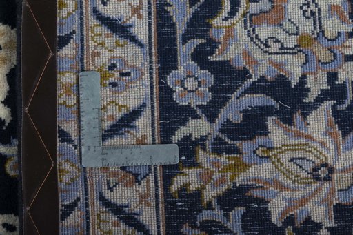 Backside of handmade New Najafabad rug showing knot structure and weave density