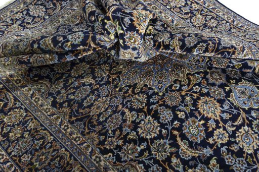 Surface texture of 2000s Najafabad rug with natural Wool and intricate pattern