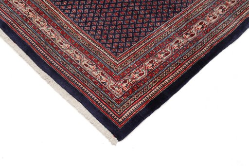 Backside of handmade 1960s Sarough rug showing knot structure and weave density