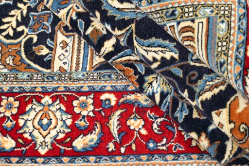 Corner detail of 1970s Sarough rug showing border pattern and Wool pile