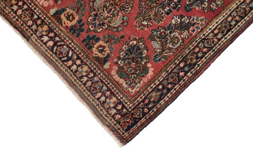 Backside of handmade 1950s Sarough rug showing knot structure and weave density