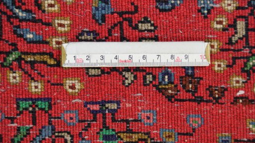 Backside of handmade 1960s Sarough rug showing knot structure and weave density