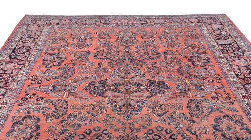 Surface texture of 1910s Sarough rug with natural Wool and intricate pattern