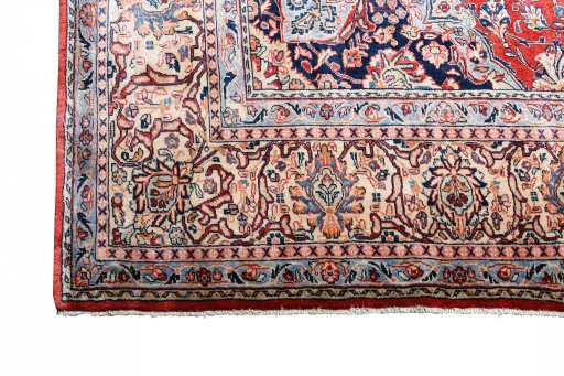 Corner detail of 2000s Sarough rug showing border pattern and Cork pile