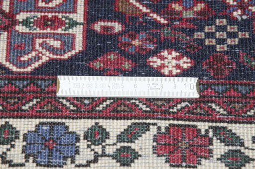 Backside of handmade 2000s Sarough rug showing knot structure and weave density