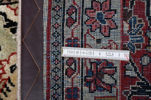 Corner detail of 2000s Sarough rug showing border pattern and Wool pile