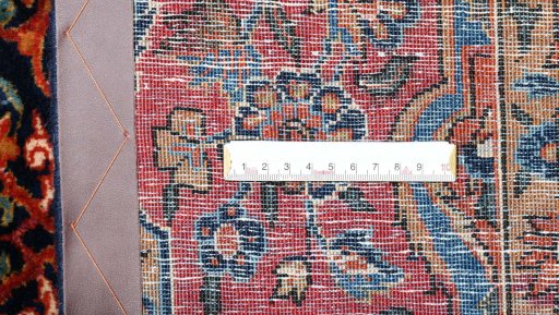 Corner detail of 1930s Sarough rug showing border pattern and Cork pile