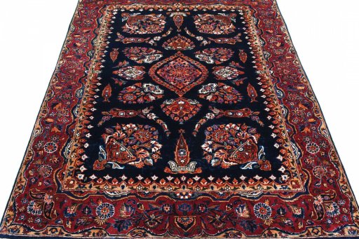Surface texture of 1930s Sarough rug with natural Cork and intricate pattern