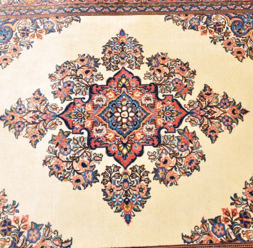 Corner detail of 2000s Sarough rug showing border pattern and Cork pile