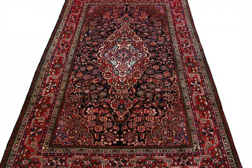 Surface texture of 2000s Sarough rug with natural Wool and intricate pattern