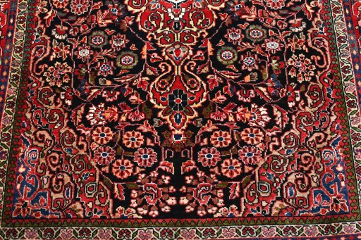 Backside of handmade 2000s Sarough rug showing knot structure and weave density
