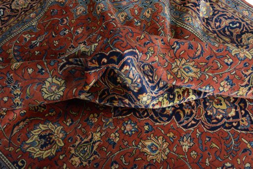 Surface texture of 2000s Sarough rug with natural Wool and intricate pattern
