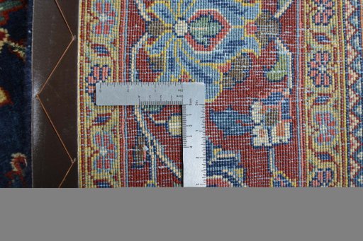 Backside of handmade 1970s Sarough rug showing knot structure and weave density