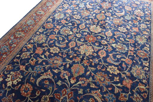 Backside of handmade 1970s Sarough rug showing knot structure and weave density