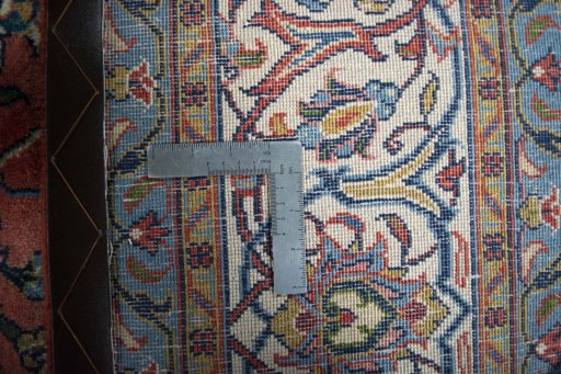 Backside of handmade New Sarough rug showing knot structure and weave density