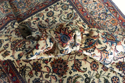 Surface texture of 2000s Sarough rug with natural Wool and intricate pattern