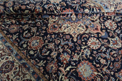 Close-up detail of 2000s Sarough rug from Iran / Persia showing Wool weave