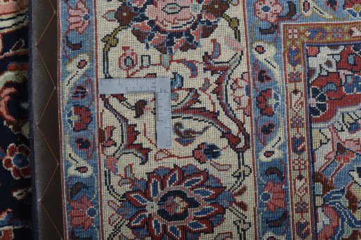Backside of handmade 2000s Sarough rug showing knot structure and weave density