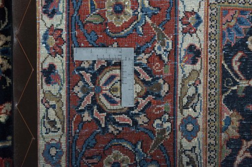Backside of handmade 1970s Sarough rug showing knot structure and weave density