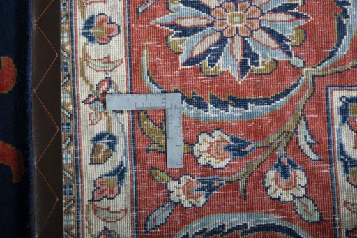 Backside of handmade New Sarough rug showing knot structure and weave density
