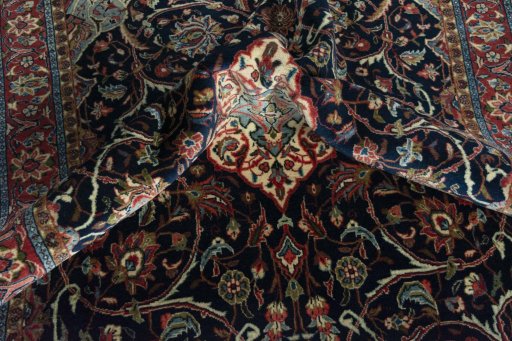 Surface texture of 2000s Sarough rug with natural Wool and intricate pattern