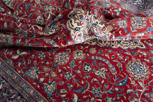 Surface texture of 2000s Sarough rug with natural Wool and intricate pattern