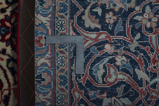 Backside of handmade 2000s Sarough rug showing knot structure and weave density