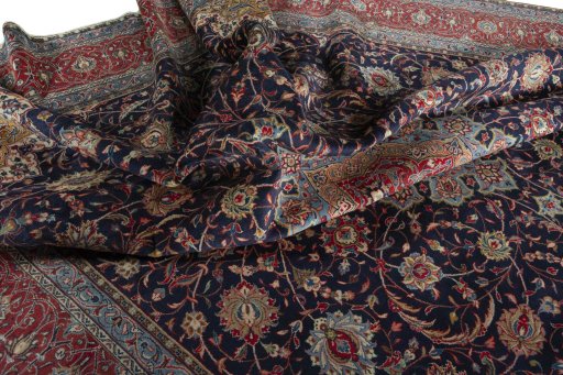 Surface texture of 2000s Sarough rug with natural Wool and intricate pattern