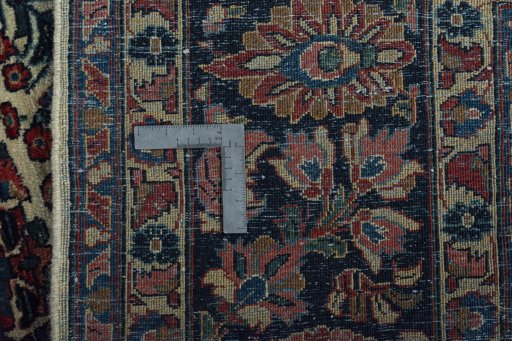Backside of handmade 1930s Sarough rug showing knot structure and weave density