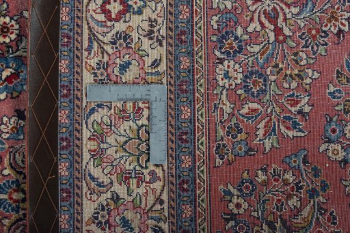 Backside of handmade 1970s Sarough rug showing knot structure and weave density