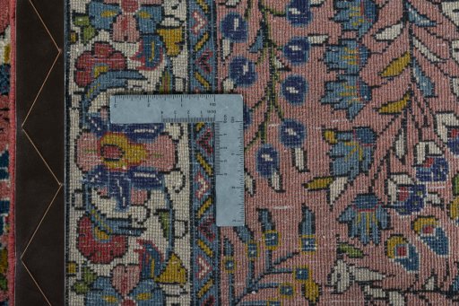 Surface texture of 2000s Sarough rug with natural Wool and intricate pattern