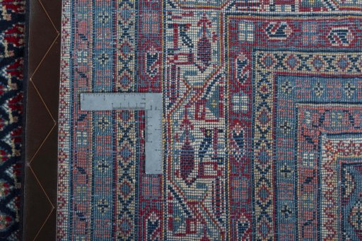 Surface texture of 1970s Sarough rug with natural Wool and intricate pattern