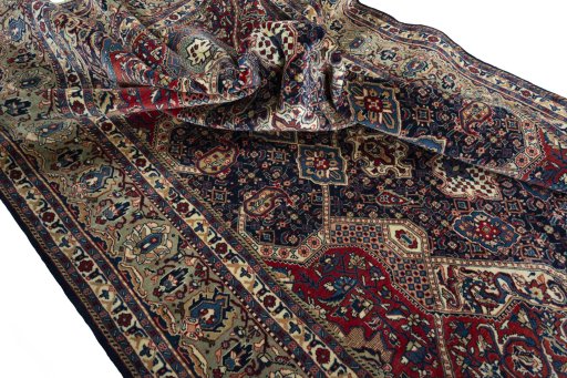 Surface texture of 2000s Sarough rug with natural Wool and intricate pattern