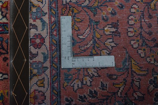 Corner detail of 2000s Sarough rug showing border pattern and Wool pile